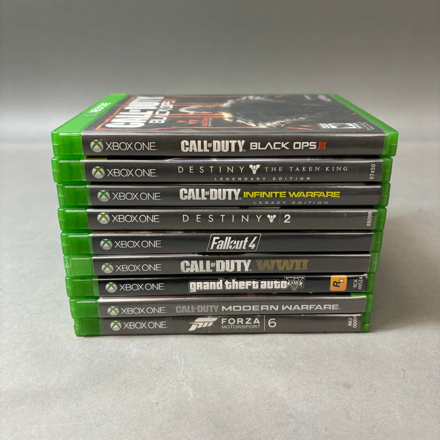 Lot of 9 Microsoft Xbox One Games Including Forza Motorsport 6, Call of Duty Modern Warfare, Grand Theft Auto V + More